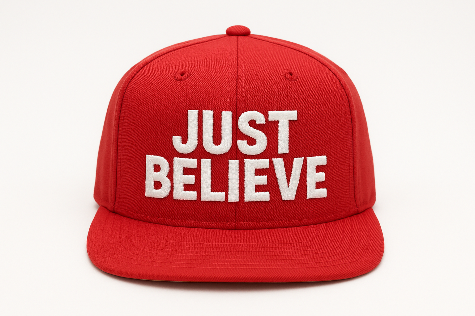 a red snapback cap with the words JUST BELIEVE written on it